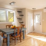 Dining area and heat pump near front door at 15 Lorne Street, Fredericton, NB E3B 2Y6 | 3-Bed Home For Sale On The Hill
