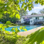 48 Bromley Avenue, Hanwell NB E3C 1M8 | Home For Sale In Hanwell with In Ground Pool | View of Pool through Leaves