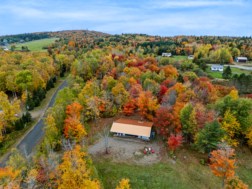 Drone view of fall foliage at 17 Flume Drive, Central Hainesville, NB E6E 1C9 | Home For Sale Near Crabbe Mountain