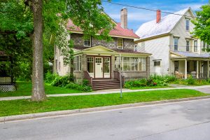 Older two-storey home on a tree-lined street in downtown Fredericton